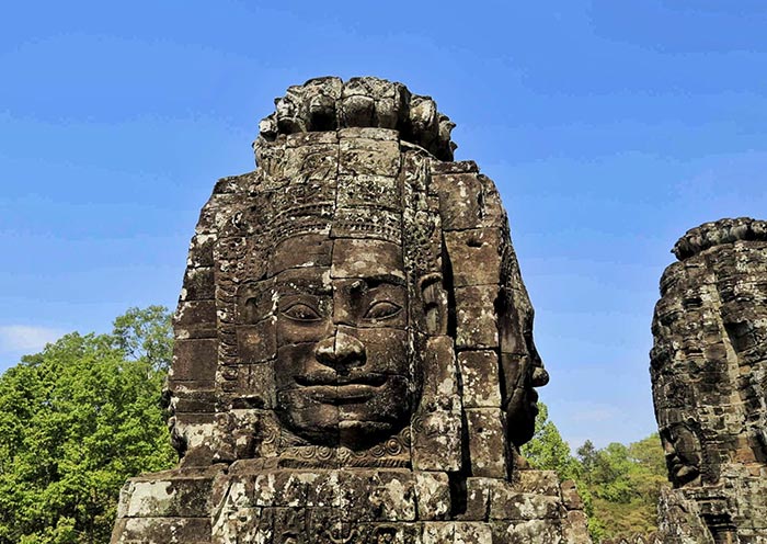 Enigmatic Smiles Through the Ages at Bayon Temple