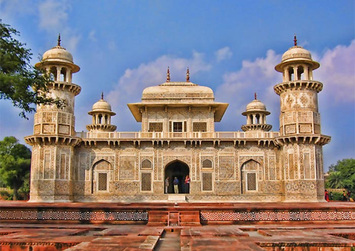 A dazzling white marble mausoleum on the banks of the Yamuna River