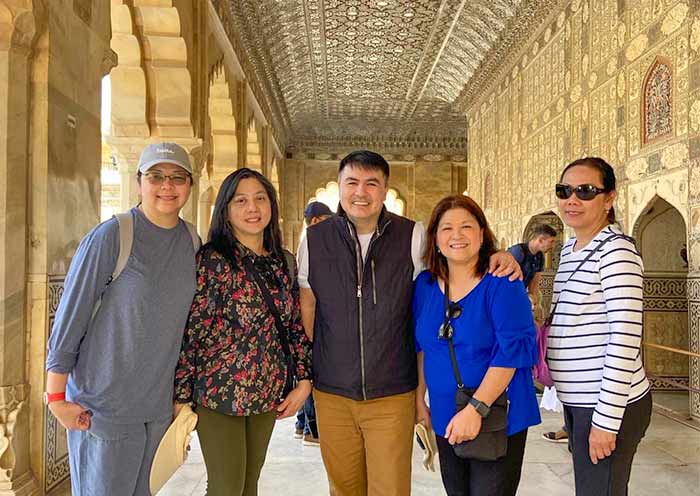 Our guest in front of the Sheesh Mahal (Mirror Palace) at Amber Fort