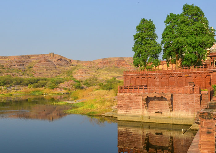 A red sandstone palace overlooks Balsamand