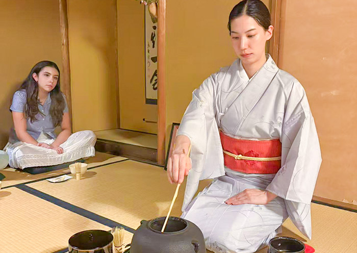 Guests taking part in a Japanese tea ceremony