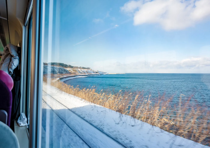 JR Train runs along the sea coast in Hokkaido