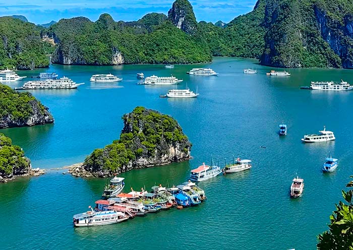 Emerald islands rise from the jade waters of Halong Bay
