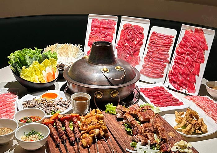 Traditional Beijing hot pot with tender lamb slices and flavorful broth