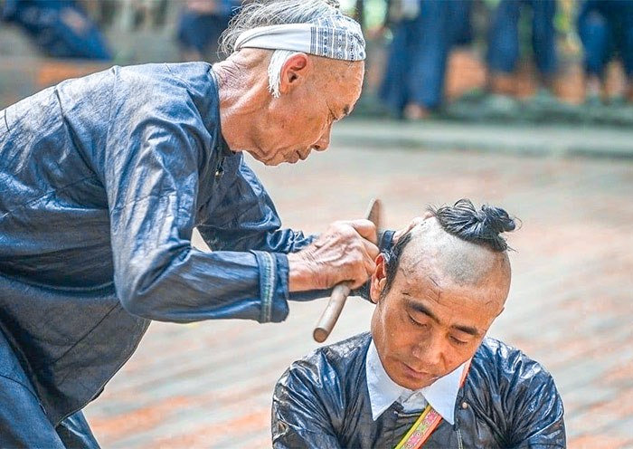 Sickle haircutting ceremony in Biasha Miao Village