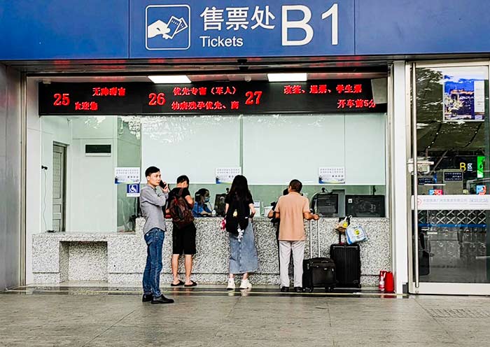 Buy train tickets at railway station