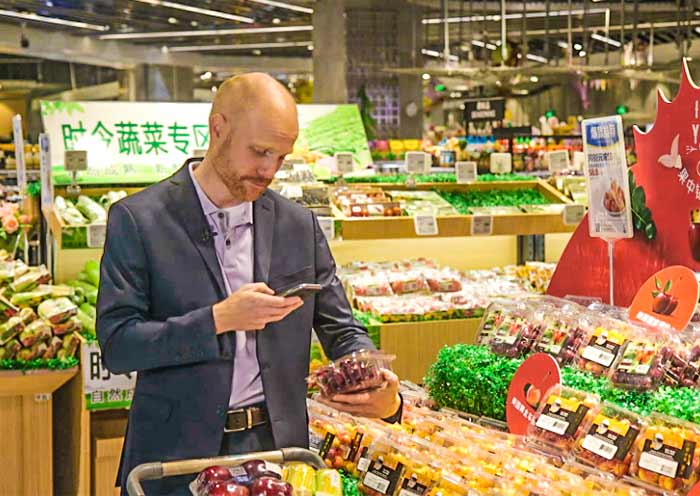  In-store shoppers can scan an item's barcode using the supermarket app to learn its source