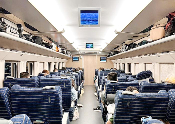 First Class seats offer more legroom and a larger reclining angle