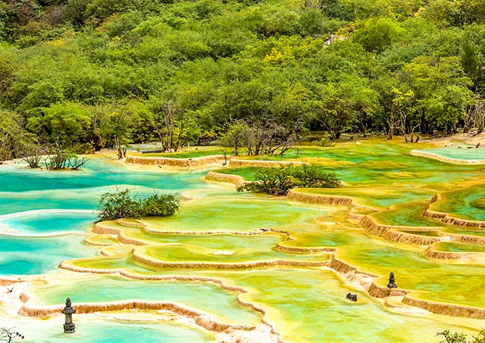 The pools are a range of colors, from turquoise to deep blue