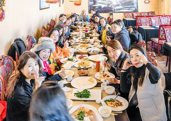 Our Guests Enjoying a Traditional Tibetan Meal