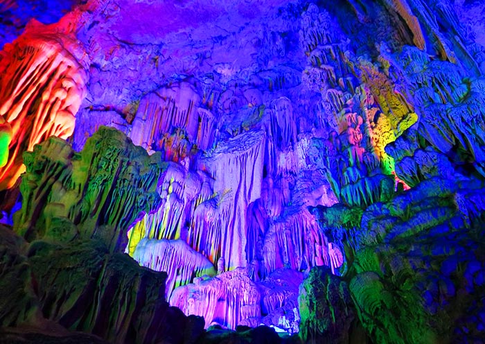 Reed Flute Cave illuminated by colorful lights Reed Flute Cave illuminated by colorful lights