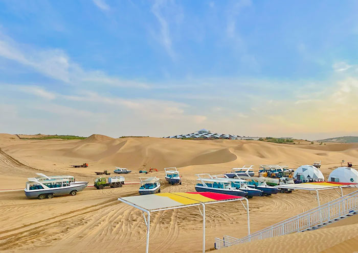 Vehicles in Sounding Sand Bay, Kubuqi Desert